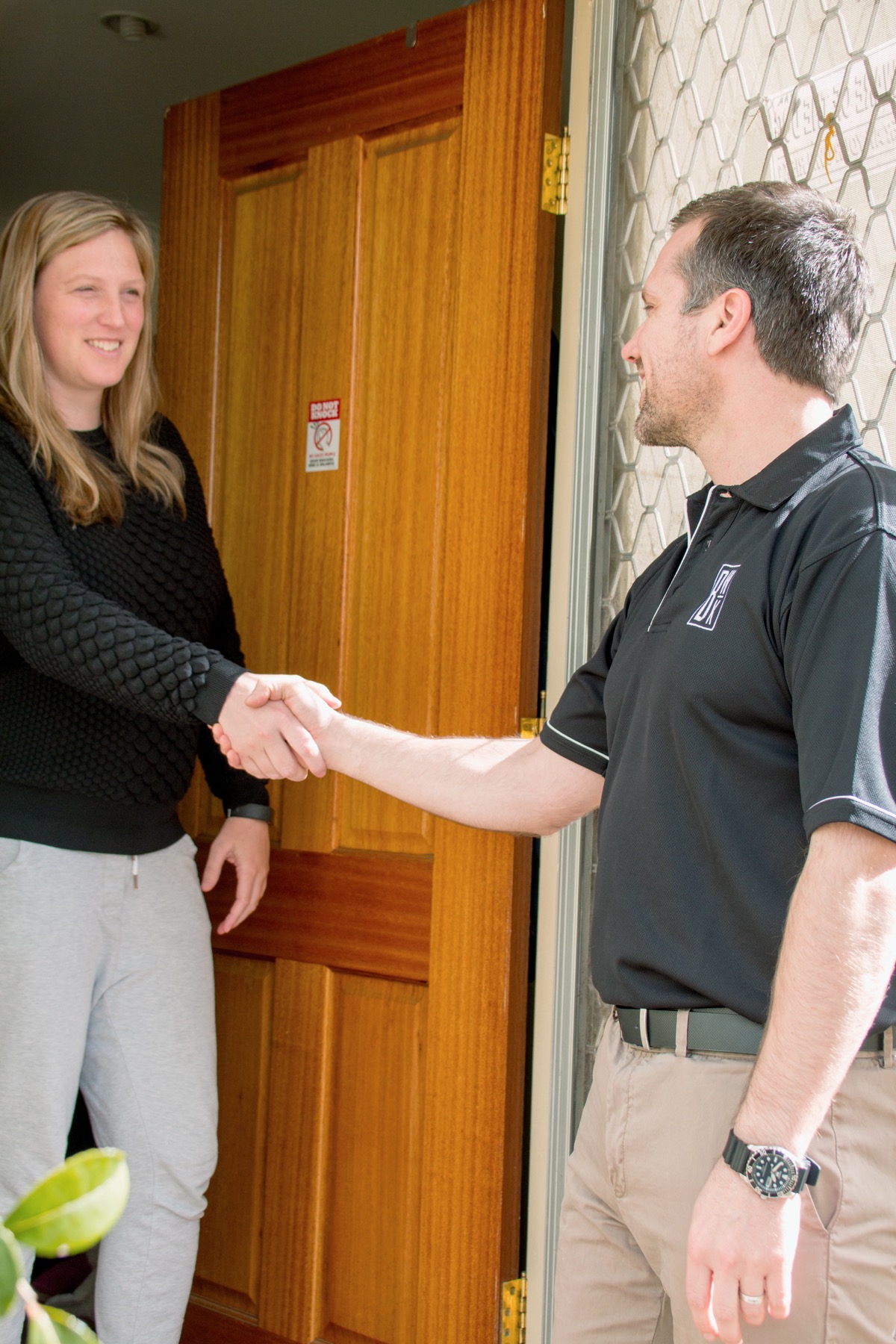 BWK Group quantity surveyor greeting a property client before a local property inspection.