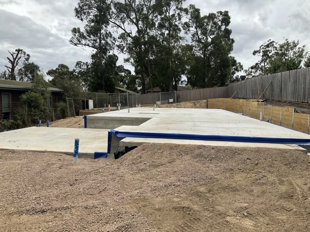 Cost to complete report photo showing slab stage construction for a lender progress payment review.
