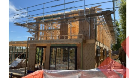 Black-and-white townhouse construction stage for owner-builder progress payment report support.