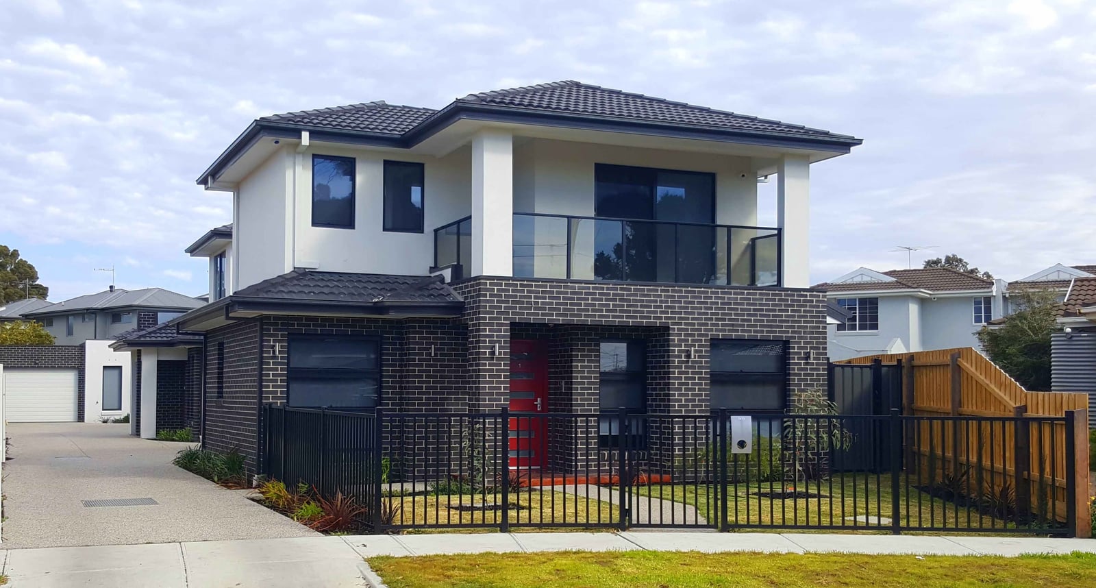 Black-and-white new residential townhouse used to represent tax depreciation schedule reporting.